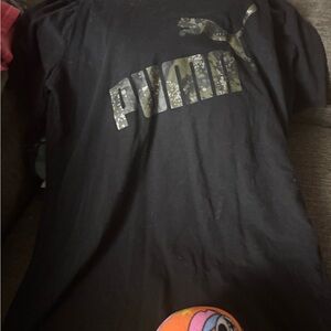 Puma shirt with camo logo and black background